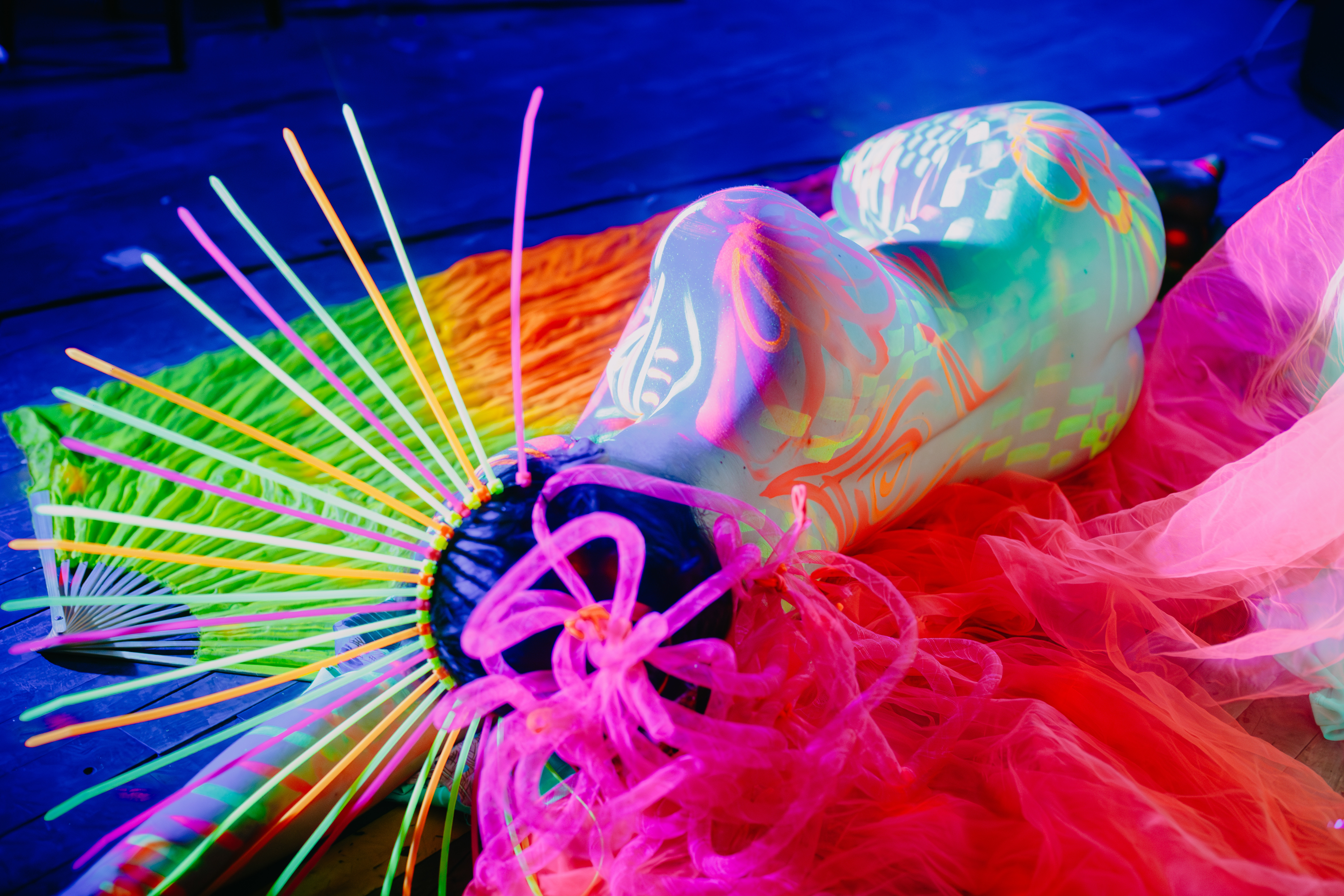 A woman posing at a neon life drawing class